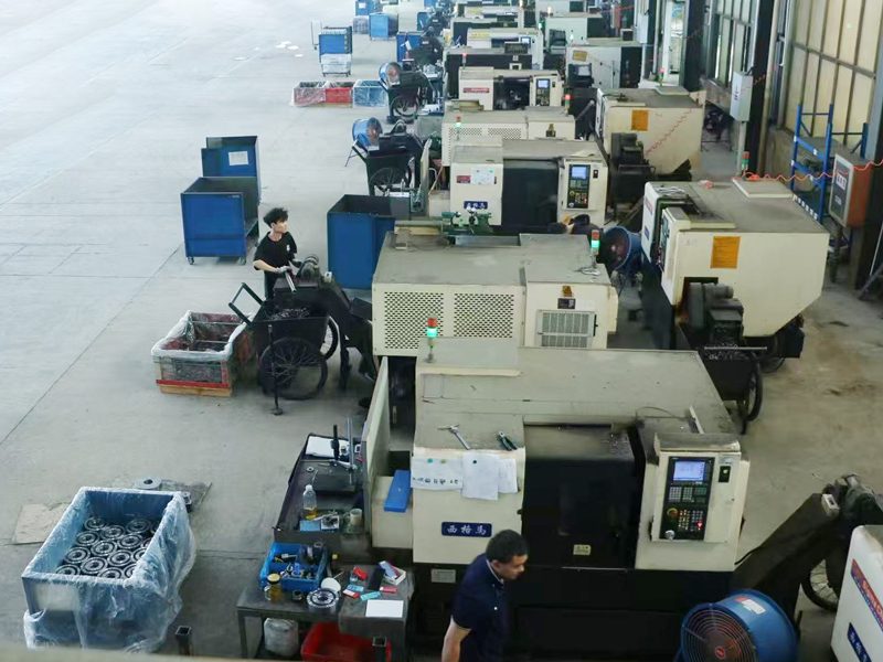 Rows of CNC lathes on the shop floor